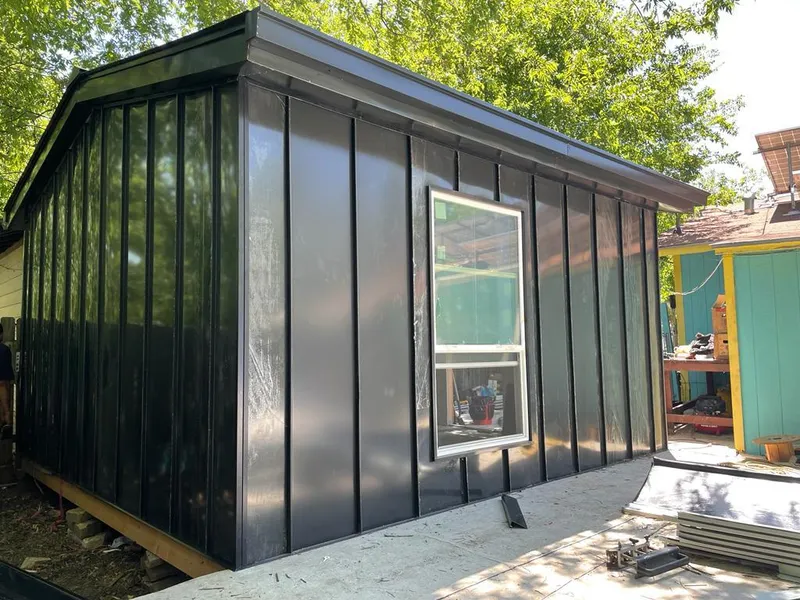 Black standing seam metal wall panels for Roof Inspection in Cold Springs