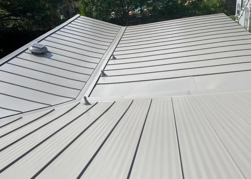 Solar attic fan installed on a metal roof for Roof Ventilation in Cold Springs